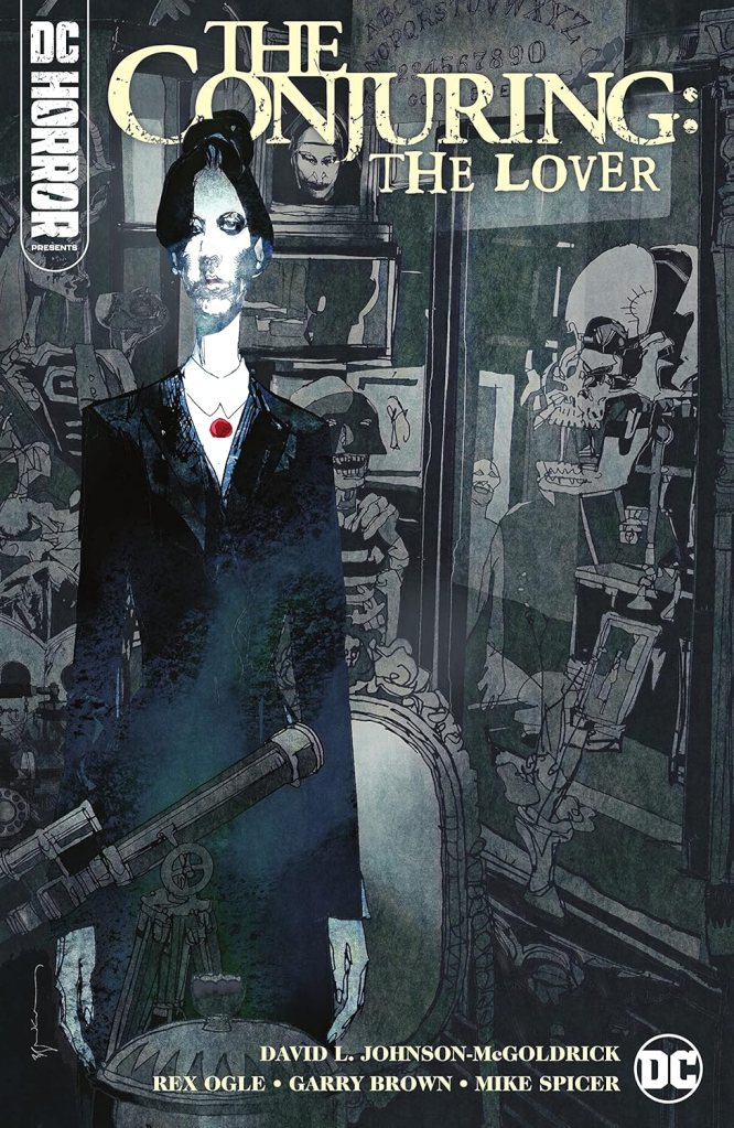 Comic book cover for 'The Conjuring: The Lover' featuring a stylized woman in a black suit with a red necklace, surrounded by eerie objects and shadowy figures.